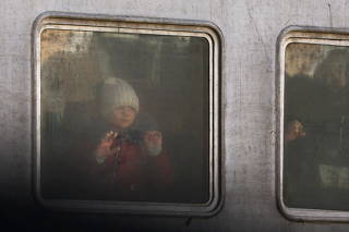 Refugees from the ongoing Russian invasion arrive at a train station in Lviv