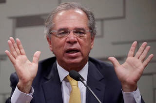 FILE PHOTO: Brazil's Economy Minister Paulo Guedes gestures during a meeting at Economic Affairs Committee (CAE) of the Brazilian Federal Senate in Brasilia