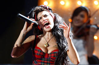 FILE PHOTO: British singer Amy Winehouse performs at the Brit Awards at Earls Court in London