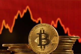 Illustration shows Bitcoin logo, representation of cryptocurrencies and decreasing stock graph