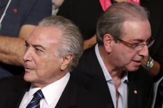 Brazil's Vice President Michel Temer is seen near President of the Chamber of Deputies Eduardo Cunha during the Brazilian Democratic Movement Party (PMDB) national convention in Brasilia