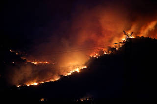 FILE PHOTO: Wildfire rages as Spain experiences its second heatwave of the year