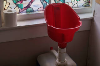 A funnel for collecting urine in the home of Kate Lucy and Jon Sellers in Brattleboro, Vt., May 4, 2022. (John Tully/The New York Times)