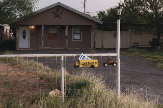 The house in front of a large trailer where smugglers held hundreds of migrants hostage, torturing and raping some to squeeze their families for more money, according to officials, in Carrizo Springs, Texas, July 17, 2022. (Christopher Lee/The New York Times)