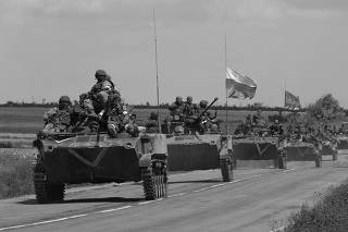 An armoured convoy of Russian troops drives in Ukraine's Zaporizhzhia region