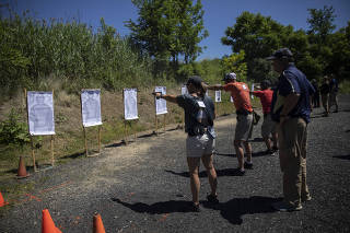 Participants shoot targets at close range at a three-day gun and active shooter training camp in Rittman, Ohio on June 22, 2022. (Maddie McGarvey/The New York Times)