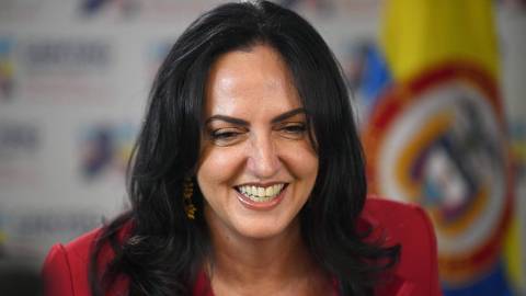 Colombian leader of the opposition in the Senate, Maria Fernanda Cabal, smiles before delivering a speech a day after the inauguration of leftist Gustavo Petro as President in Bogota, on August 8, 2022. - Gustavo Petro, the first left-wing president in Colombia's history, was sworn in on Sunday in front of hundreds of thousands of people in Bogota, calling on armed groups to sign peace and end the 