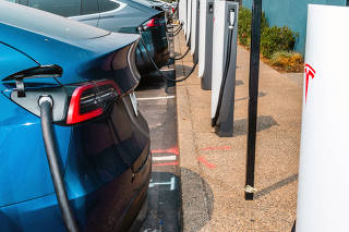 New credits favor companies, like Tesla and General Motors, that have been selling electric cars for years and have reorganized their supply chains to produce vehicles in the United States. (Kelsey McClellan/The New York Times)