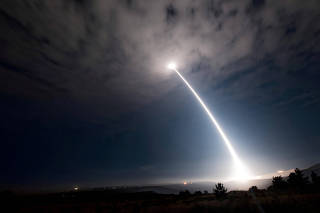 FILE PHOTO: An unarmed Minuteman III intercontinental ballistic missile launches from Vandenberg Air Force Base