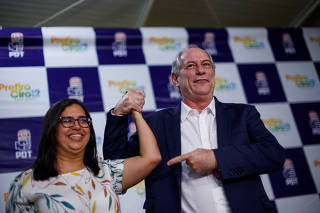 Presidential candidate Ciro Gomes and Ana Paula Matos pose for a picture after a news conference announcing her as vice president candidate in Brasilia
