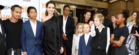 Director Angelina Jolie arrives on the red carpet with her six children (L-R) Maddox Jolie-Pitt, Pax Jolie-Pitt, Vivienne Jolie-Pitt, Knox Leon Jolie-Pitt, Shiloh Jolie-Pitt, and Zahara Jolie-Pitt for the film 