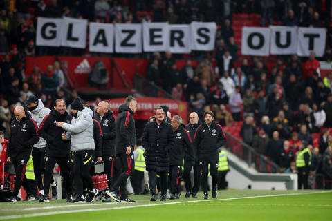 FILE PHOTO: Soccer Football - Premier League - Manchester United v Chelsea - Old Trafford, Manchester, Britain - April 28, 2022 Manchester United interim manager Ralf Rangnick is seen as fans display banners in protest of the Glazer family?s ownership of the club inside the stadium before the match REUTERS/Phil Noble EDITORIAL USE ONLY. No use with unauthorized audio, video, data, fixture lists, club/league logos or 'live' services. Online in-match use limited to 75 images, no video emulation. No use in betting, games or single club /league/player publications.  Please contact your account representative for further details./File Photo ORG XMIT: FW1