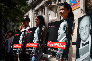 Supporters of author Salman Rushdie attend a reading and rally to show solidarity for free expression at the New York Public Library in New York