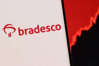 FILE PHOTO: Illustration shows a smartphone with displayed Bradesco logo and stock graph