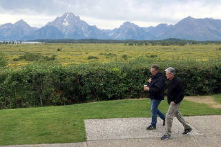 FILE PHOTO: Federal Reserve Chair Jerome Powell and New York Federal Reserve President John Williams walk together in Jackson Hole