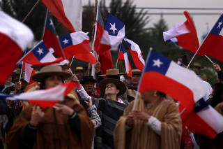 Demonstrators take part in a rally ahead of the September 4th constitutional referendum, in Santiago
