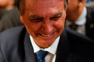 Brazil's President Jair Bolsonaro looks on after a debate in Brasilia