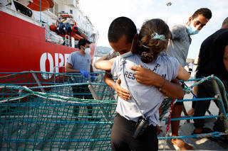 Migrants on board Open Arms rescue boat arrive at Messina port