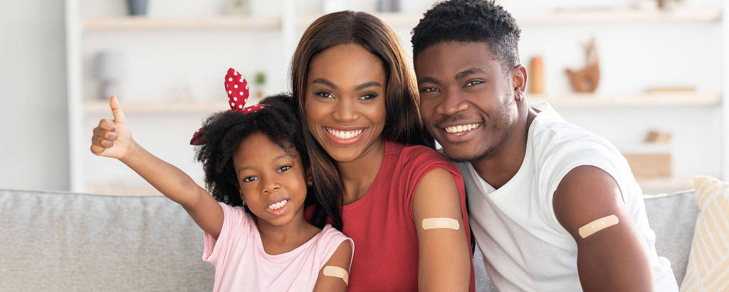 Vaccination Concept. Portrait Of Black Vaccinated Family Of Three With Adhesive Bandage On Arms, Happy African American Mother, Father And Little Daughter Posing At Home After Covid-19 Vaccine Shot