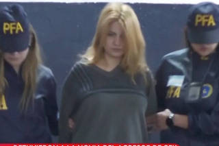 A screen grab from a video shows Brenda Uliarte, girlfriend of Fernando Andres Sabag Montiel, while she is being detained by police, in Buenos Aires