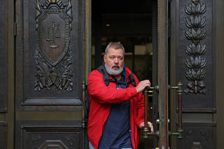 Novaya Gazeta newspaper's editor-in-chief Dmitry Muratov leaves a court building in Moscow