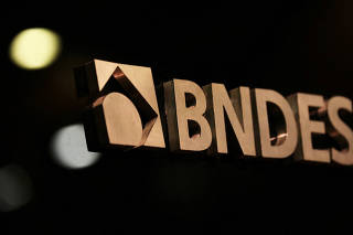 FILE PHOTO: A logo of BNDES is seen during a swearing-in ceremony of the bank's new president in Rio de Janeiro