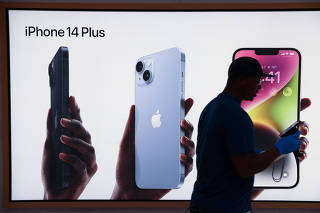 Signage is seen at the Apple Fifth Avenue store for the release of the Apple iPhone 14 range in Manhattan, New York City