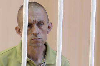 A still image shows Briton Shaun Pinner in a courtroom cage at a location given as Donetsk