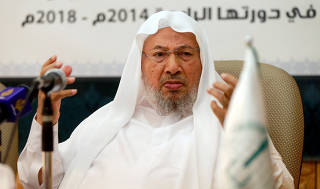 FILE PHOTO: Chairman of the International Union of Muslim Scholars Youssef al-Qaradawi speaks during a news conference in Doha
