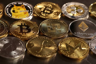 FILE PHOTO: Illustration shows representations of cryptocurrencies