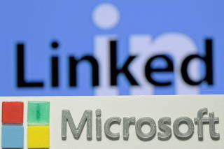 FILE PHOTO: A 3D-printed logo of Microsoft is seen in front of a displayed LinkedIn logo in this illustration