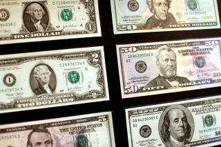 FILE PHOTO: United States dollar banknotes are seen at the Museum of American Finance in New York