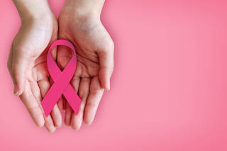Pink,Ribbon,On,Hands,For,Breast,Cancer,Awareness