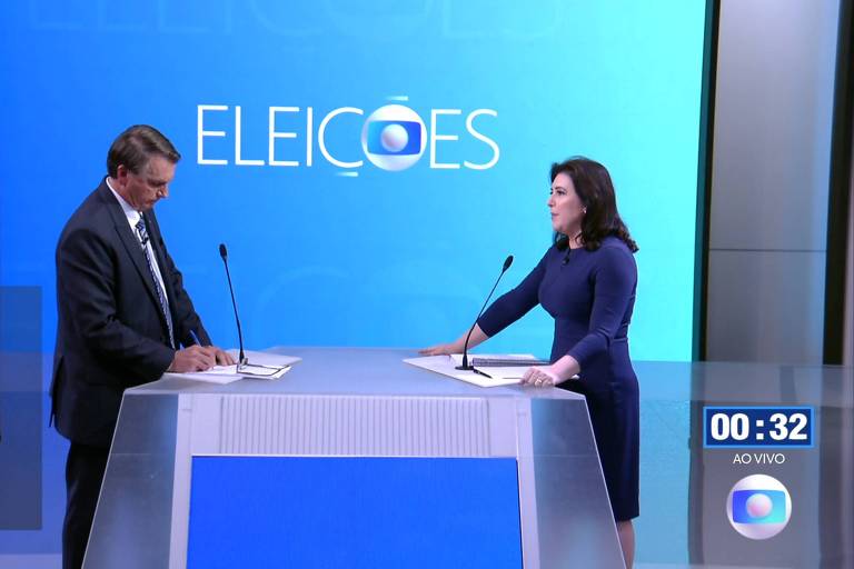 Os candidatos Jair Bolsonaro e Simone Tebet, durante debate para presidente na Globo