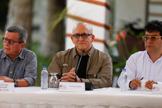 Members of Colombia's government and Colombia's National Liberation Army (ELN) delegation address the media, in Caracas