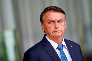 Brazil's President and candidate for re-election Jair Bolsonaro attends a news conference at the Alvorada Palace in Brasilia