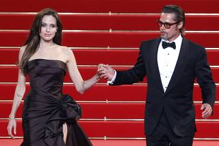 Cast member Pitt and actress Jolie leave the festival palace after the screening of the film The Tree of Life in competition at the 64th Cannes Film Festival