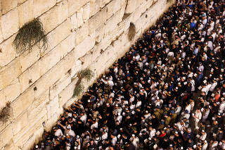 Jewish worshippers take part in Slichot, a prayer ahead of Yom Kippur, at the Western Wall in Jerusalem's Old City