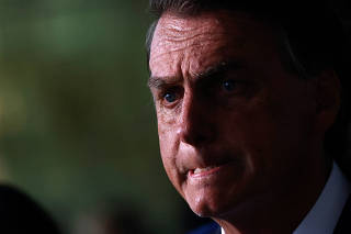 Brazil's President and candidate for re-election Jair Bolsonaro attends a news conference with elected senators at the Alvorada Palace in Brasilia