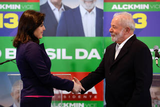 Former president of Brazil and current presidential candidate Luiz Inacio Lula da Silva greets Simone Tebet as she announces her support for him in Sao Paulo