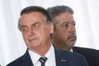 Brazil's President and candidate for re-election Jair Bolsonaro and Lower House President Arthur Lira  attend a meeting with elected parliamentarians and governors who support Bolsonaro at the Alvorada Palace in Brasilia