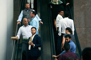 Office workers at Brookfield Place, a vast office-mall complex in ManhattanÕs financial district, on Oct. 10, 2022.   (Casey Steffens/The New York Times)