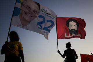 Supporters of Brazil's President and candidate for re-election Jair Bolsonaro and former President Luiz Inacio Lula da Silva campaign in Brasilia