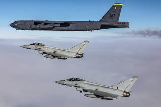 RAF Fighter Jets accompany USAF B-52 Bombers as they arrive in Britain