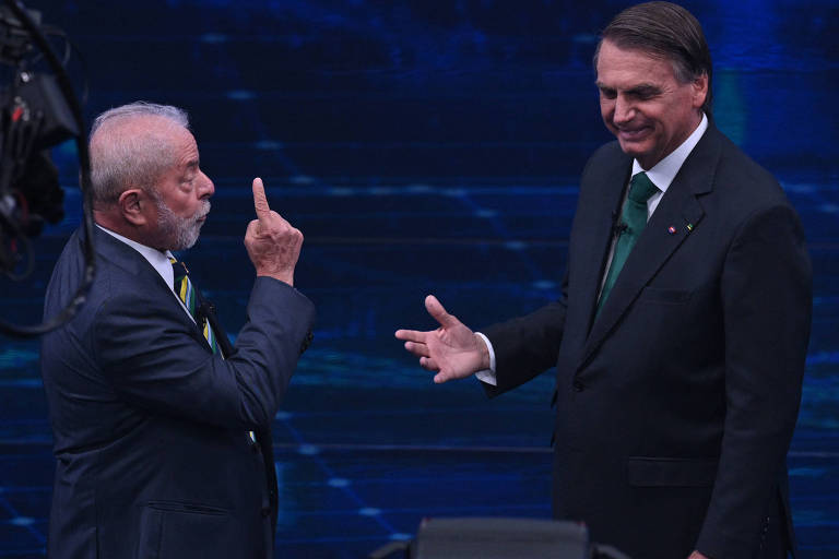O ex-presidente Luiz Inácio Lula da Silva (PT) e o presidente Jair Bolsonaro (PL) durante debate na Band