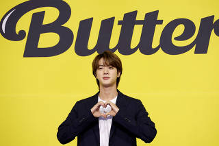 FILE PHOTO: K-pop boy band BTS member Jin poses for photographs during a photo opportunity promoting their new single 'Butter' in Seoul
