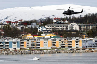 FILE PHOTO: A helicopter patrols off Tromsoe