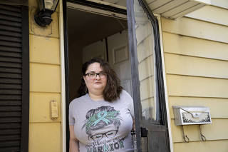 Kathryn Wiltz, who repeatedly asked her employer to let her work from home because of her disability, but was denied, at her home in Wyoming, Mich., Oct. 23, 2022. (Sarah Rice/ The New York Times)