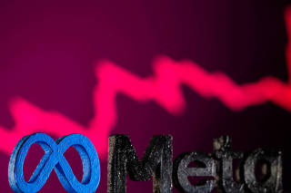 FILE PHOTO: A 3D printed Facebook's new rebrand logo Meta is seen in front of displayed stock graph in this illustration