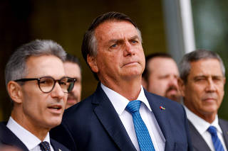 Brazil's President and candidate for re-election Jair Bolsonaro attends a news conference at the Alvorada Palace in Brasilia